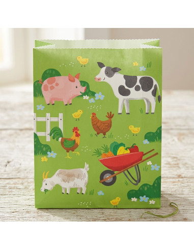 Sacs cadeaux animaux de la ferme sur fond vert avec poule, cochon, vache, chèvre et brouette de légumes.